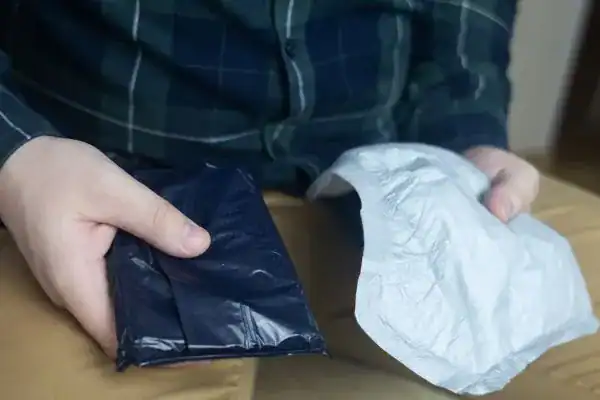 image of man holding stool incontinence Wigan products